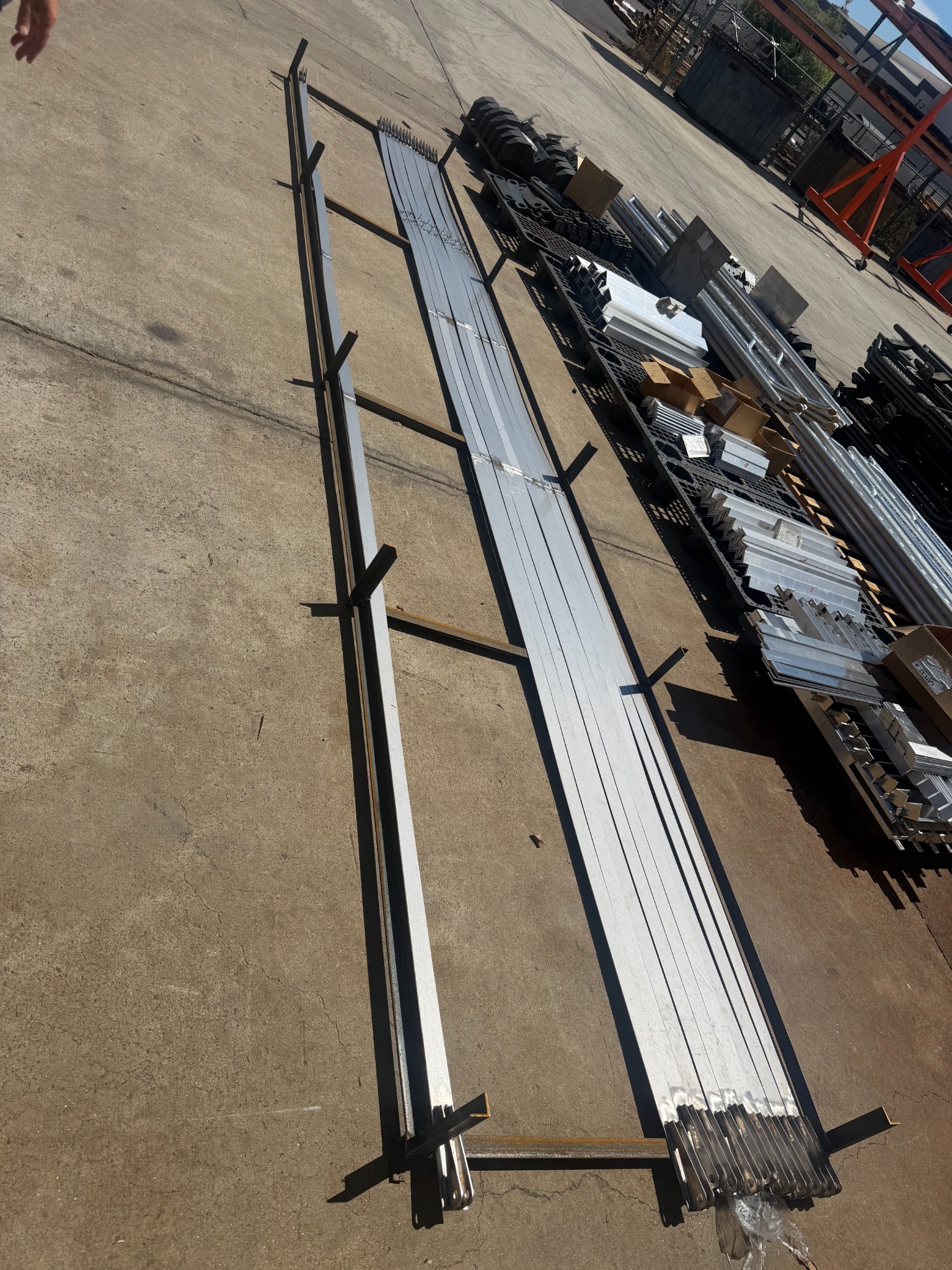 Long fabricated sheet metal assemblies arranged for production